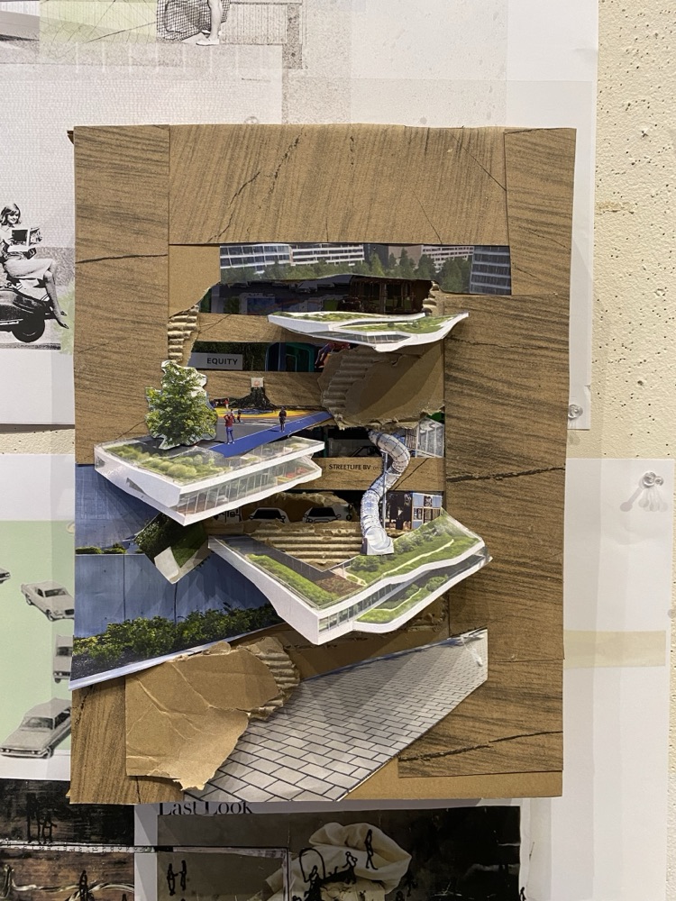 A cardboard model of stacked planted terraces cut from magazine photographs
