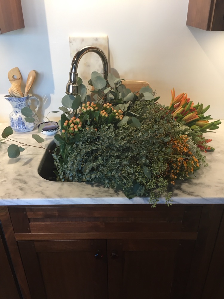 Mirror selfie with an armful of eucalyptus and white roses